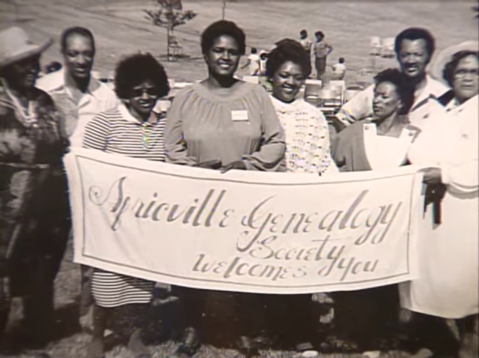 Members of the Africville Genealogy Society holding a banner at a reunion event (Remember Africville, 00:31:35).